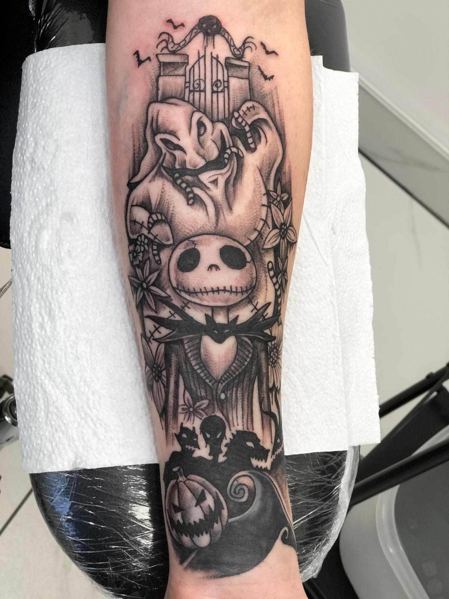 Black and grey illustrative Nightmare Before Christmas forearm tattoo